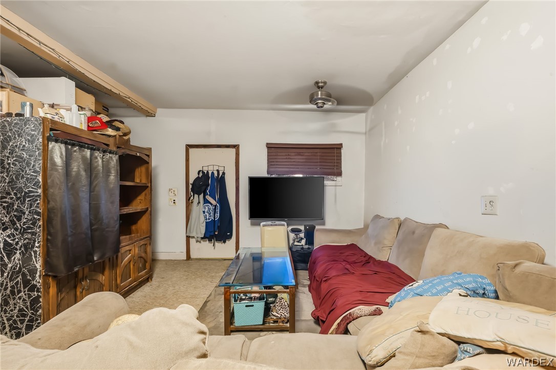10031 Dike Road Mohave Valley, AZ 86440 - Photo 25 of 78 a living room with furniture and a flat screen tv