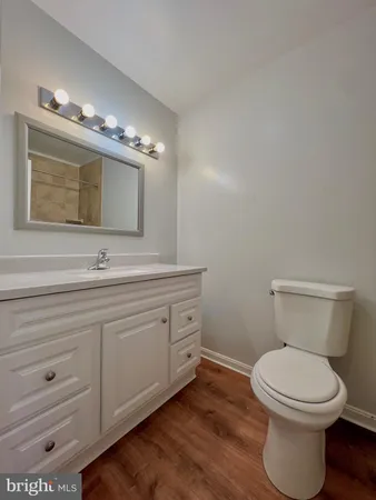 a bathroom with a sink vanity and mirror