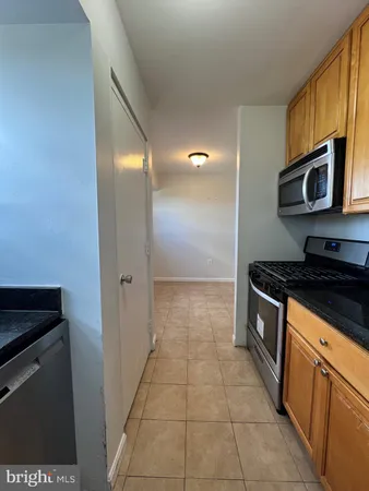 a kitchen with a sink and a window