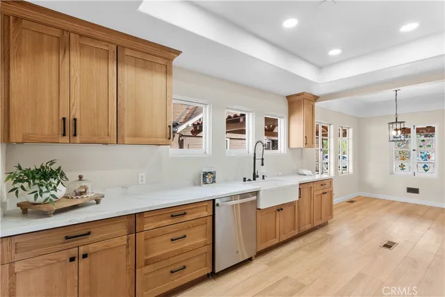 a spacious bathroom with a granite countertop sink mirror and cabinets