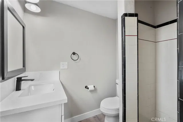 a row of palm trees in front of house