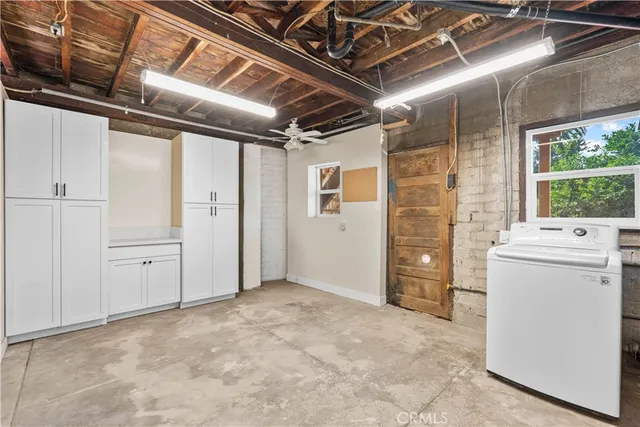an aerial view of a houses with street