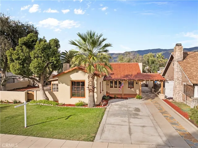 an aerial view of a residential houses with outdoor space