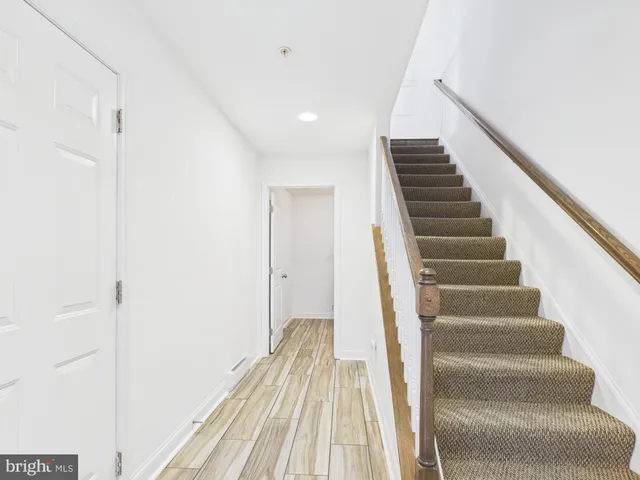 a view of entryway with wooden floor