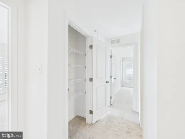 a view of a bathroom with white door