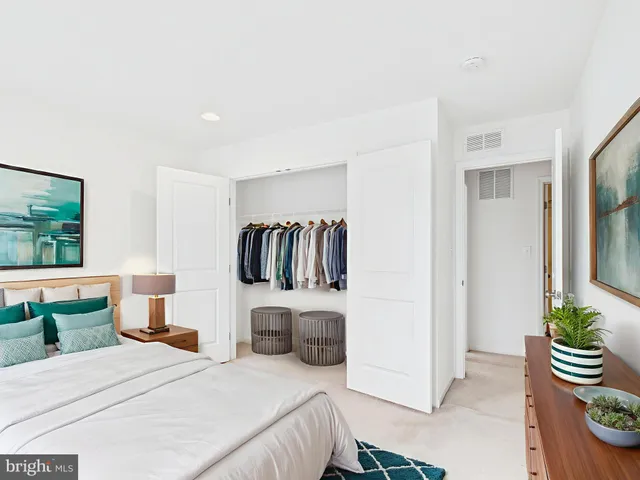 a bedroom with a bed and a television