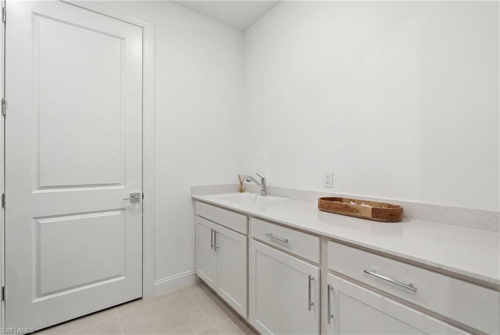 18364 Ridgeline Drive Estero, FL 33928 - Photo 31 of 50 a utility room with dryer and washer