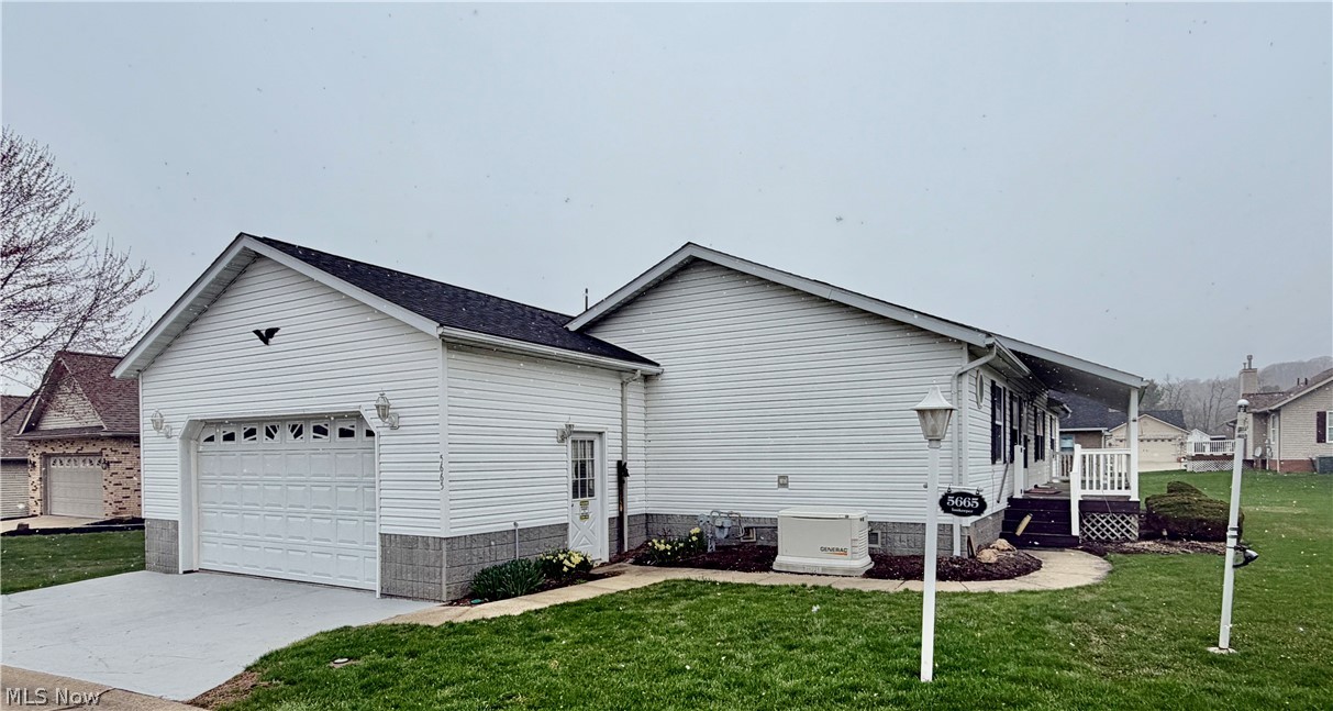 5665 Innkeeper Street Southeast Dennison, OH 44621 - Photo 3 of 13 Attached Side Load Garage
