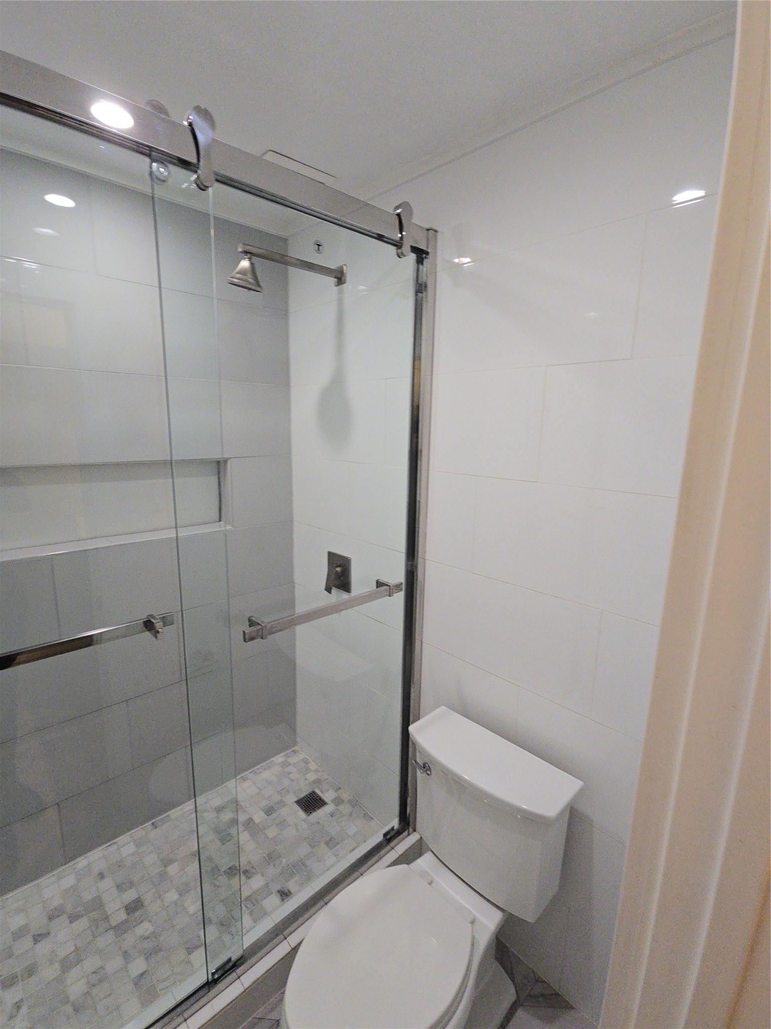 10101 South Gessner Road, Unit 708 Houston, TX 77071 - Photo 13 of 20 a bathroom with a toilet and a shower