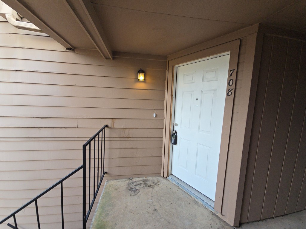 10101 South Gessner Road, Unit 708 Houston, TX 77071 - Photo 2 of 20 a view of wooden door