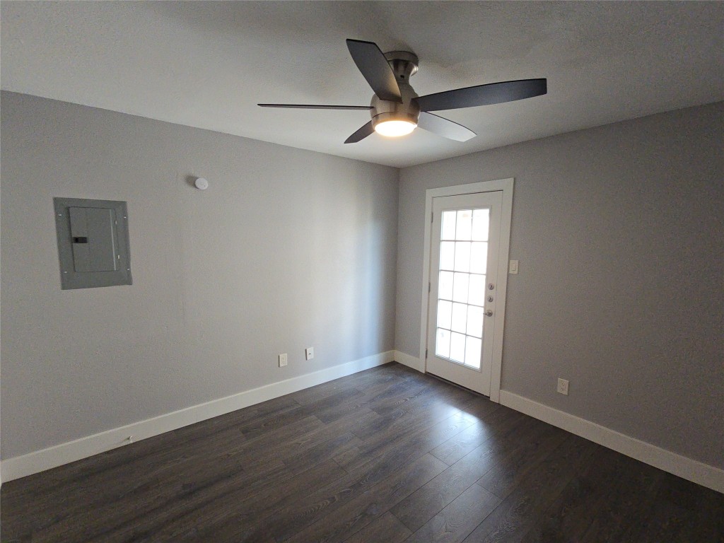 10101 South Gessner Road, Unit 708 Houston, TX 77071 - Photo 5 of 20 a view of empty room with wooden floor and fan