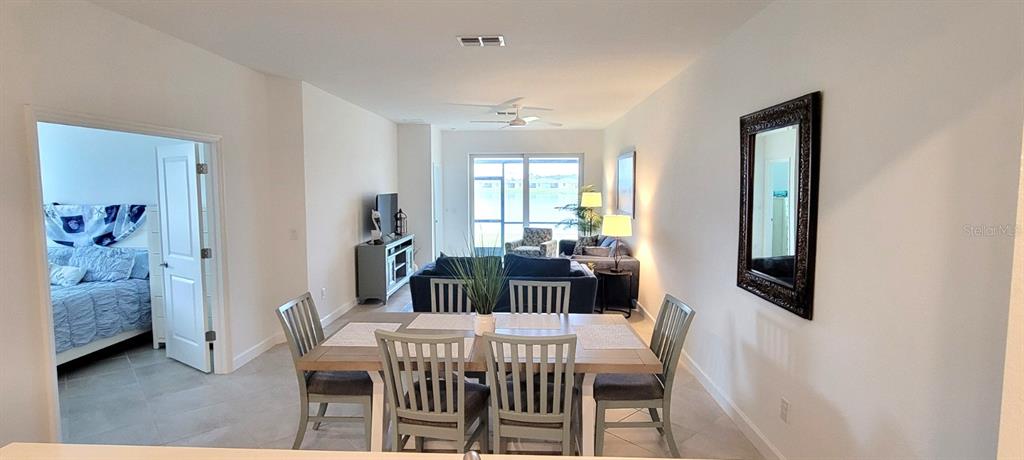 8787 St Kitts Circle Englewood, FL 34224 - Photo 14 of 29 a view of a dining room with furniture and window