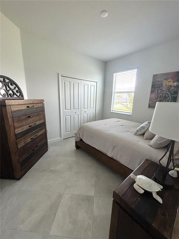 8787 St Kitts Circle Englewood, FL 34224 - Photo 17 of 29 a bedroom with a bed and a window