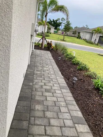 a view of a yard next to a building