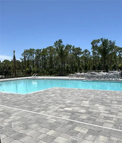 a view of a swimming pool and a yard