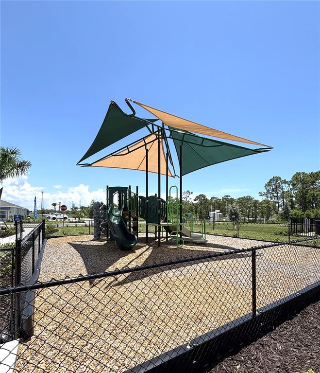 8787 St Kitts Circle Englewood, FL 34224 - Photo 23 of 29 an outdoor sitting area with a couch