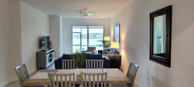 a view of a dining room with furniture window and outside view