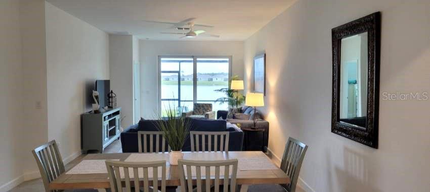 8787 St Kitts Circle Englewood, FL 34224 - Photo 9 of 29 a view of a dining room with furniture window and outside view