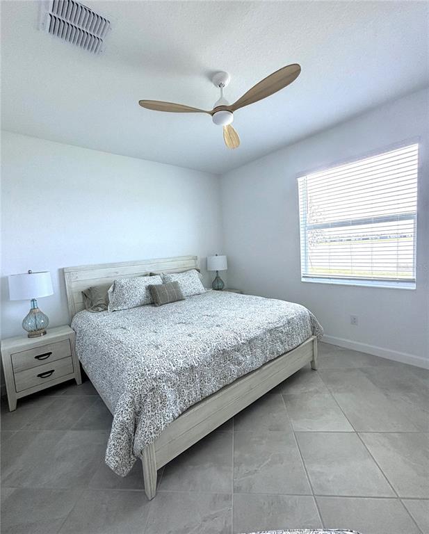 8787 St Kitts Circle Englewood, FL 34224 - Photo 10 of 29 a bedroom with a bed and a window