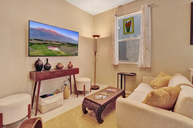 a bedroom with furniture and a window