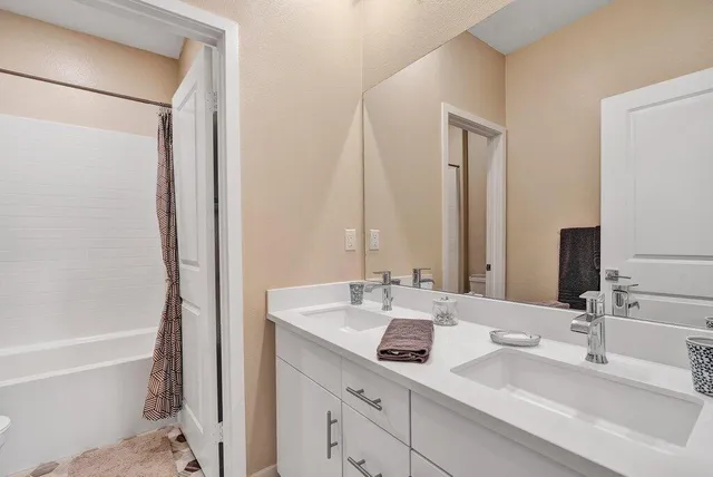 a living room with furniture and a lamp