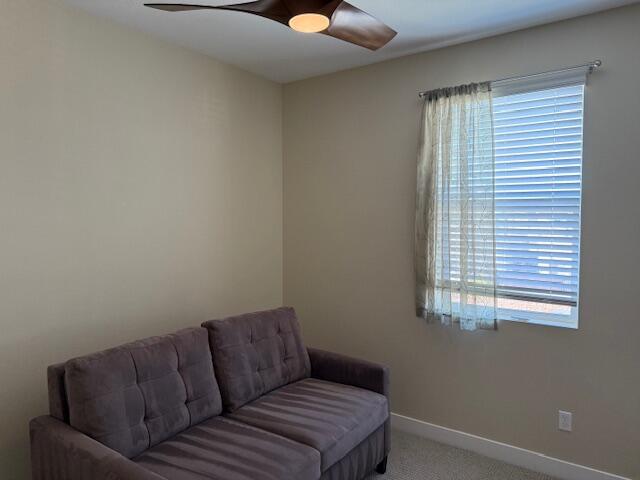 76345 Cornell Way Palm Desert, CA 92211 - Photo 26 of 47 a living room with a couch and a window