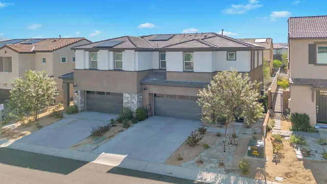 an aerial view of residential building and lake