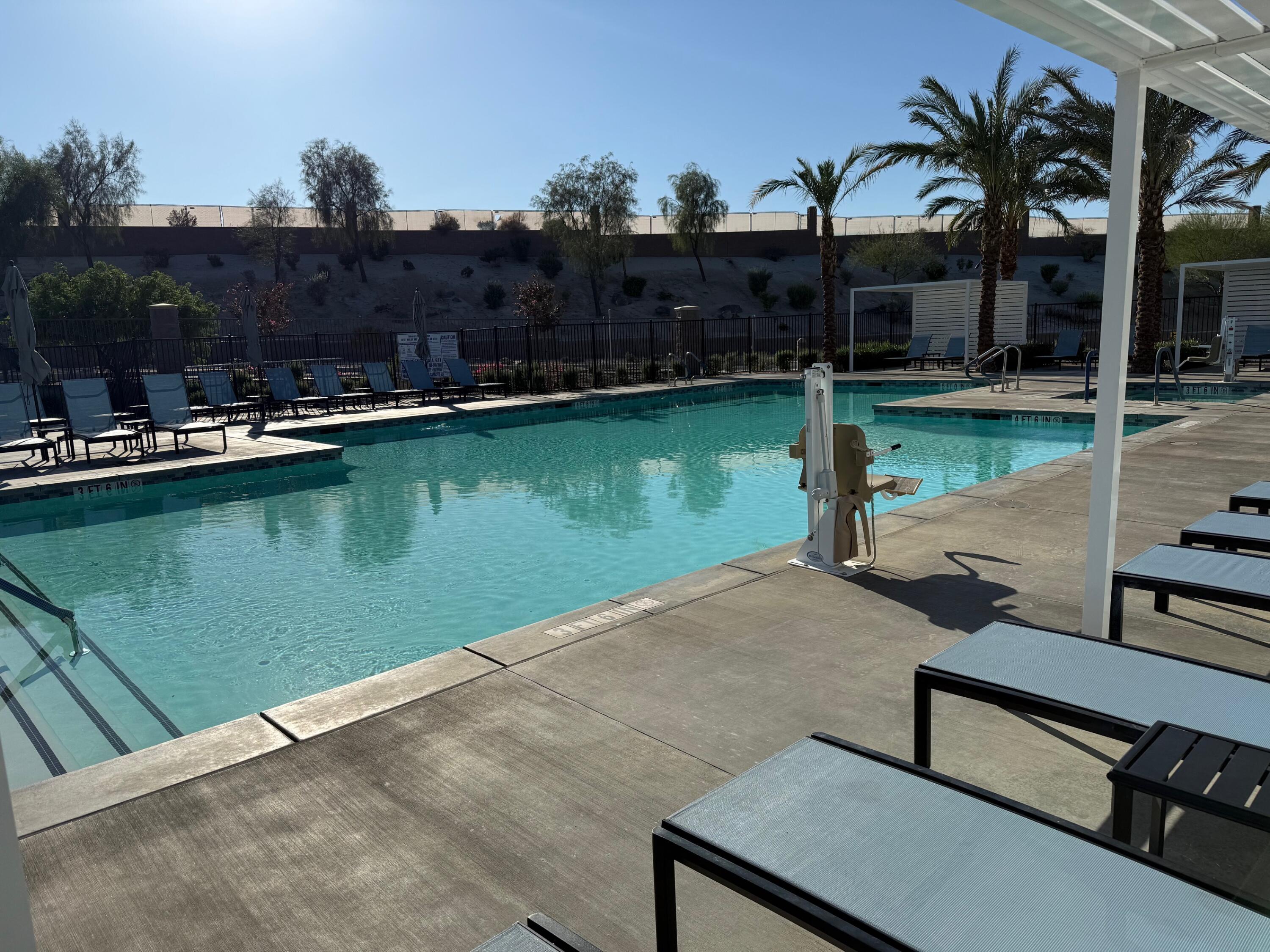 76345 Cornell Way Palm Desert, CA 92211 - Photo 39 of 47 a view of a swimming pool with a patio