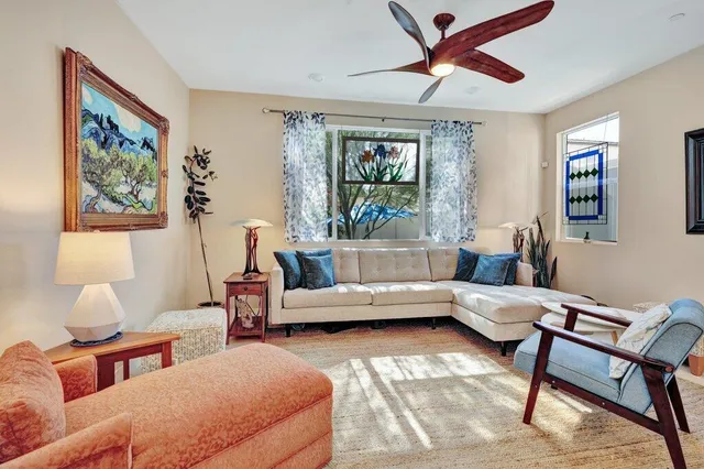 a living room with furniture and a window