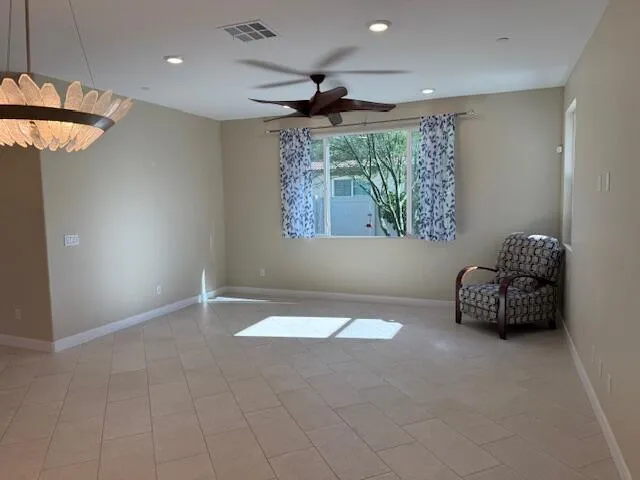 a room with a bed and a chandelier