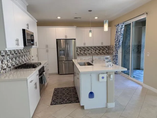 a kitchen with a sink and refrigerator