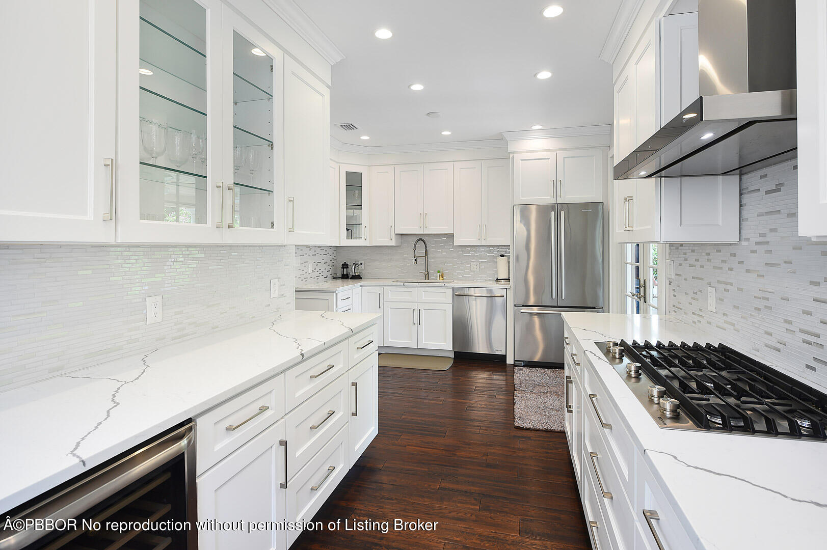 230 Rugby Road West Palm Beach, FL 33405 - Photo 5 of 13 a kitchen with white cabinets and appliances