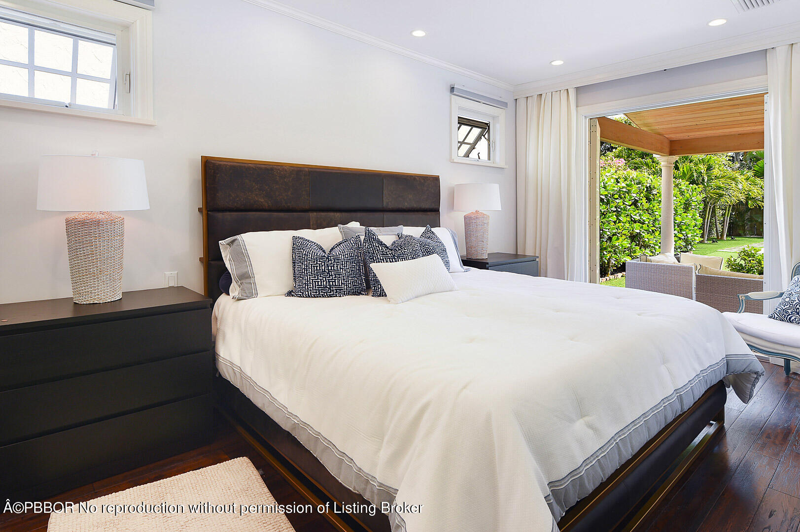 230 Rugby Road West Palm Beach, FL 33405 - Photo 8 of 13 a large bed sitting in a bedroom next to a window