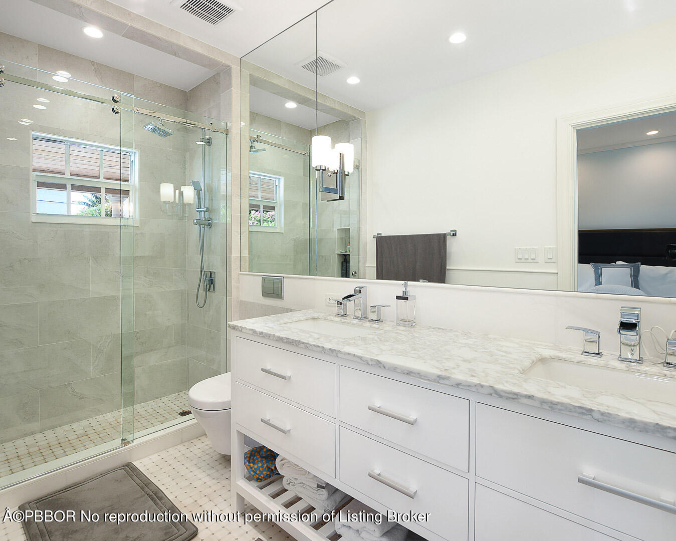 230 Rugby Road West Palm Beach, FL 33405 - Photo 9 of 13 a bathroom with a granite countertop sink a toilet a mirror and shower