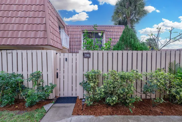 an aerial view of a house with a swimming pool