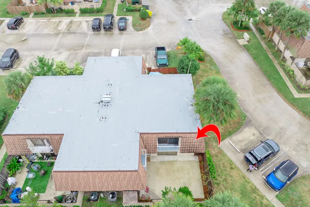 an aerial view of residential houses with outdoor space