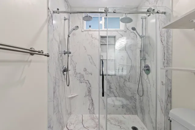 a bathroom with a shower and a tub