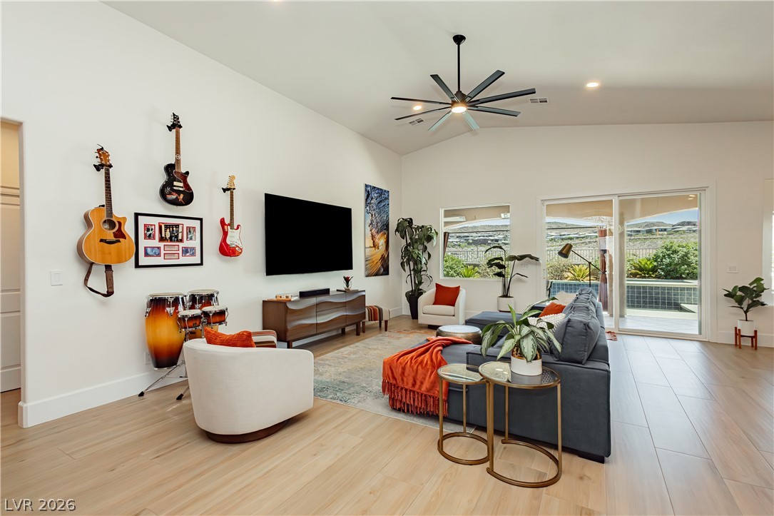 2256 Dogwood Ranch Avenue Henderson, NV 89052 - Photo 13 of 51 Bright, high-ceilinged living space boasts expansive views and direct outdoor access.