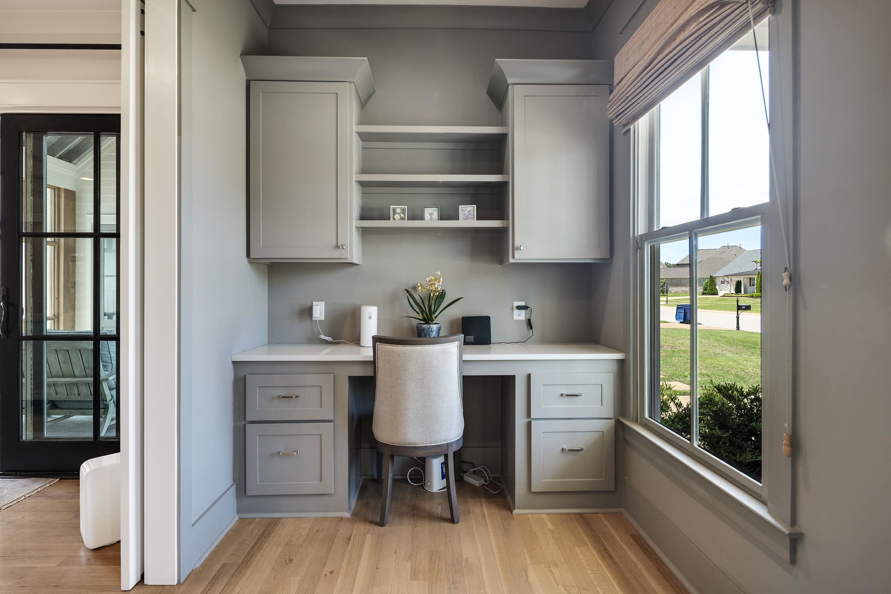 100 Sunflower View Road Piperton, TN 38017 - Photo 8 of 29 Dedicated office nook featuring built-in cabinetry, shelving, light-toned wood-finish flooring, and a large window