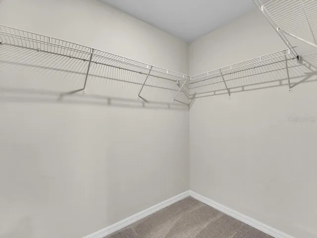 a view of a room with racks on the wall