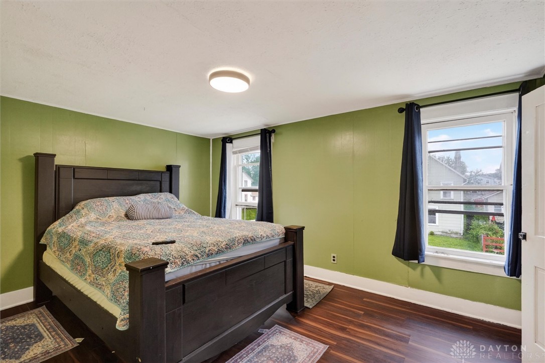 1726 Morgan Street Springfield, OH 45503 - Photo 28 of 30 This spacious bedroom features warm wood flooring and ample natural light through large windows.
