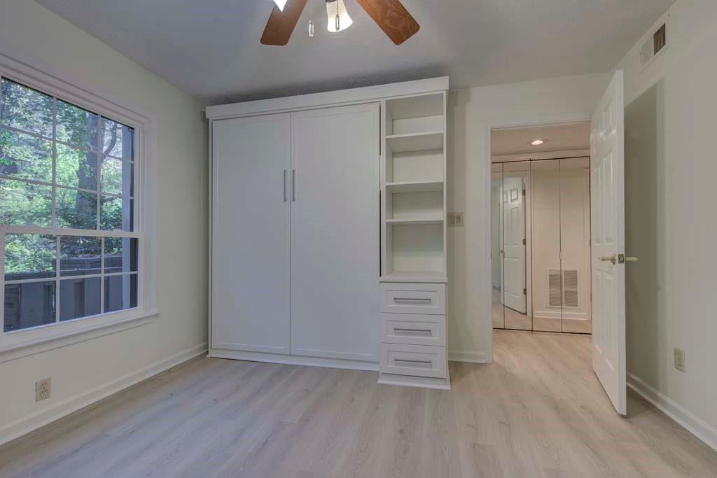 166 Maribeau Square Northwest Atlanta, GA 30327 - Photo 23 of 28 an empty room with windows and closet