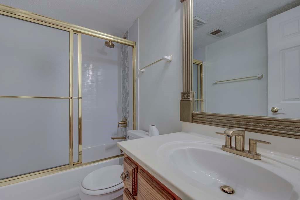 166 Maribeau Square Northwest Atlanta, GA 30327 - Photo 24 of 28 a bathroom with a sink a toilet and shower