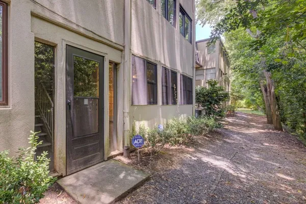 a view of a house with brick walls