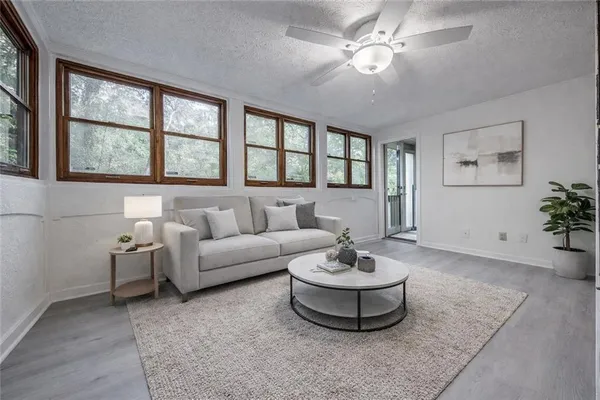 a living room with furniture and a large window