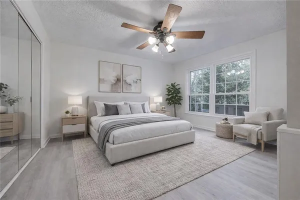 a bedroom with a large bed and furniture