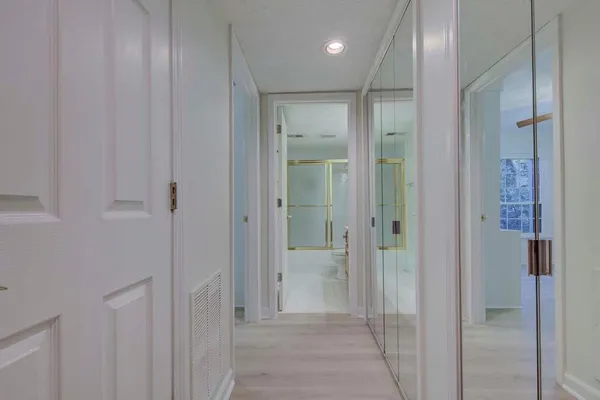 a bathroom with a glass shower door