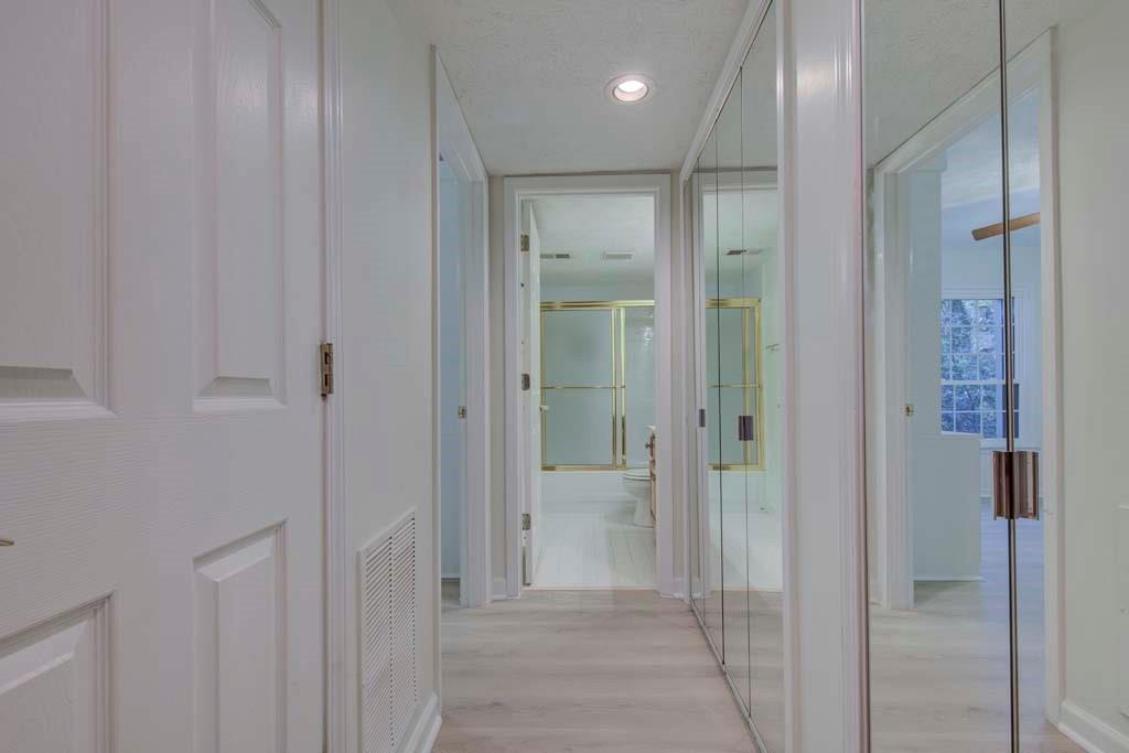 166 Maribeau Square Northwest Atlanta, GA 30327 - Photo 7 of 28 a bathroom with a glass shower door