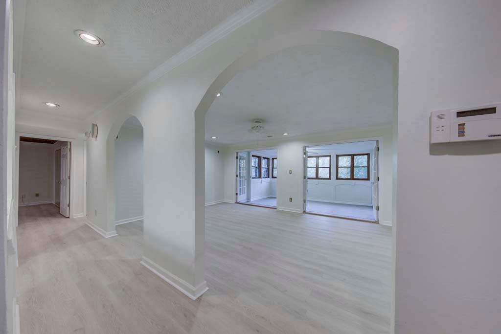 166 Maribeau Square Northwest Atlanta, GA 30327 - Photo 8 of 28 an empty room with wooden floor and windows