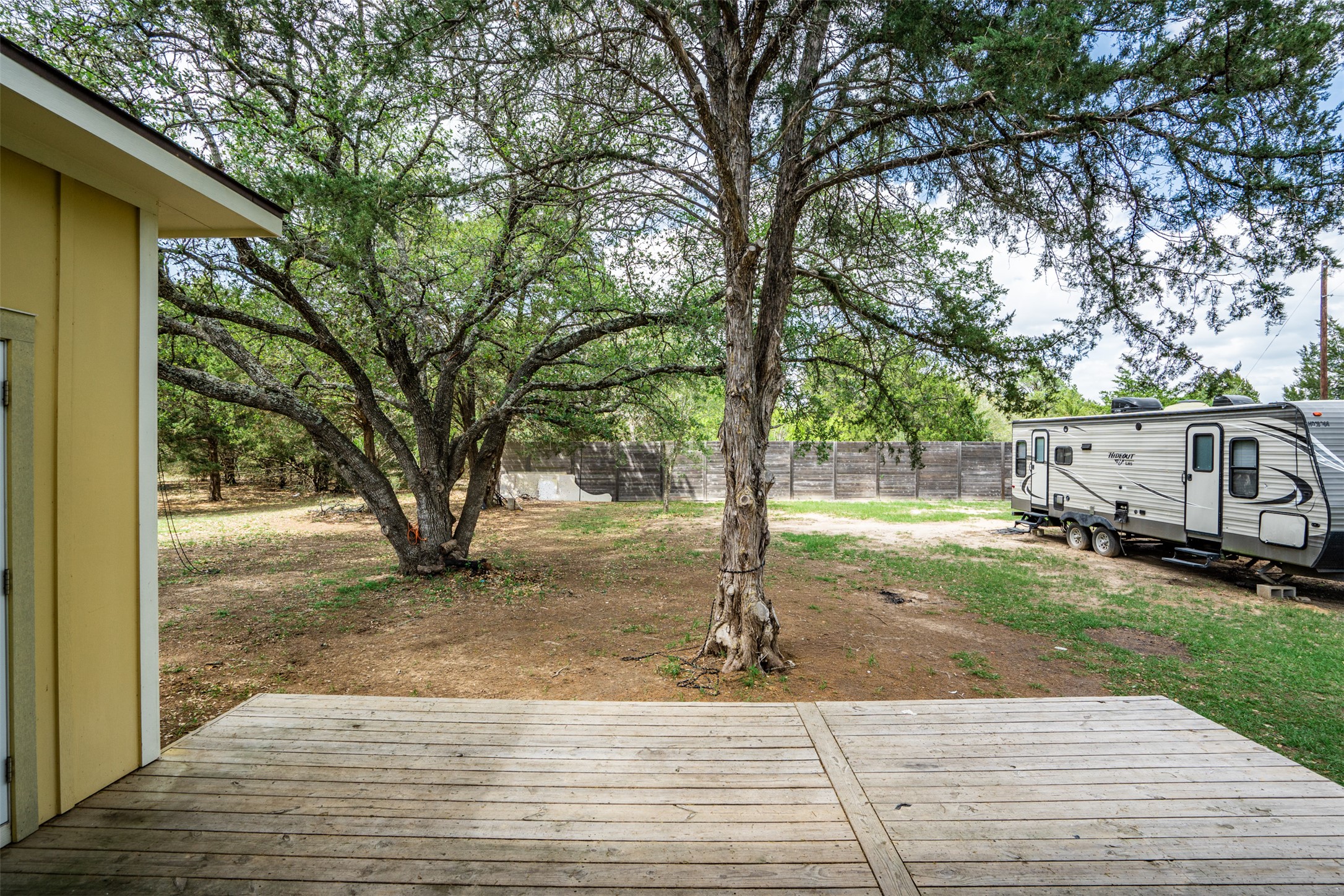 1354 Old Pin Oak Road Paige, TX 78659 - Photo 33 of 37 a backyard of a house with table and chairs